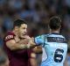 Rivals: Billy Slater and James Maloney clash during Origin II.