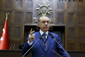 Turkey's President Recep Tayyip Erdogan, gestures as he talks to members of the ruling Justice and Development party (AKP), in Ankara, Turkey, Tuesday, June 13, 2017.