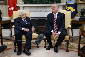 President Donald Trump talks to reporters during a meeting with former Secretary of State Henry Kissinger in the Oval Office of the White House, Wednesday, May 10, 2017, in Washington.