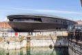 The museum building housing the Mary Rose with another famous warship, the HMS Victory, in the foreground.