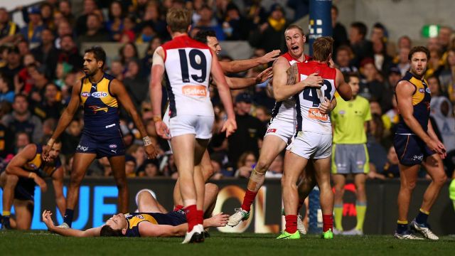 Demons defender Tom McDonald celebrates a late goal to steal the game from West Coast.