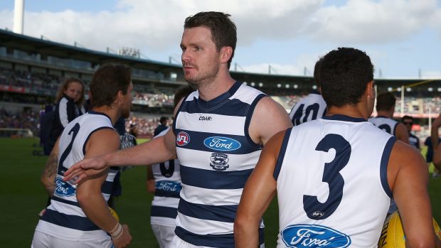 PERTH, AUSTRALIA - MARCH 26: Patrick Dangerfield of the Cats revs up his team mates while runningonto the field during ...