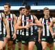 The defeated Magpies walk off the ground but coach Nathan Buckley still hopes for finals.
