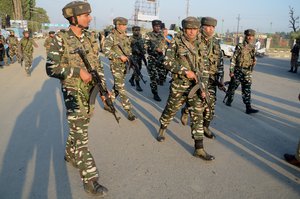 Indian police and paramilitary men arrive where militants attacked a vehicle of the paramilitary Central Reserve Police Force (CRPF) at Pantha Chowk on the outskirts of Srinagar, the summer capital of Indian Kashmir, 24 June 2017. Militants attacked a CRPF vehicle in which one paramilitary Central Reserve Police Force (CRPF) soldier was killed while another solider and a civilian were injured.