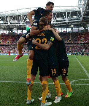 The Socceroos celebrate James Troisi's first-half goal.