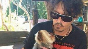 Johnny Depp with one of his Yorkshire terriers illegally brought to Australia.