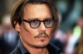 Johnny Depp has said sorry after joking in Britain about assassinating President Trump.