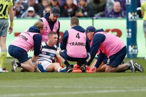 Hard knocks: Joel Selwood after his accidental collision with Hayden Ballantyne.