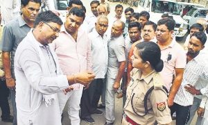 Police officer Shrestha Thakur stands upto  BJP protesters at the district court compound in Bulandshahr on Friday. Photo: Hindustan Times