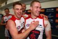 Dom Tyson and Tom McDonald celebrate the Demons' win.