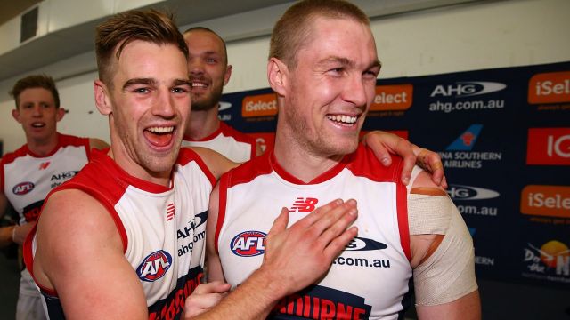 Dom Tyson and Tom McDonald celebrate the Demons' win.