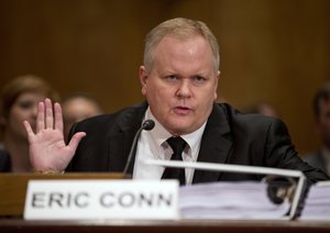 In this Monday, Oct 7, 2013 file photo, attorney Eric Conn gestures as he invokes his Fifth Amendment rights against self-incrimination during a Senate Homeland Security and Governmental Affairs committee hearing on Capitol Hill in Washington.