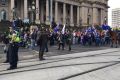 Protesters gather at Parliament House.