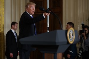 President Donald Trump gestures as he leaves after signing the "Department of Veterans Affairs Accountability and Whistleblower Protection Act of 2017" in the East Room of the White House, Friday, June 23, 2017, in Washington.