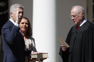 Supreme Court Justice Anthony Kennedy administers the judicial oath to Judge Neil Gorsuch during a re-enactment in the Rose Garden of the White House White House in Washington, Monday, April 10, 2017.