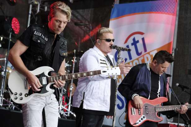 FILE - In this  May 22, 2017, file photo, Rascal Flatts band members, from left, Joe Don Rooney, Gary LeVox and Jay DeMarcus perform on NBC's "Today" show at Rockefeller Plaza in New York. The band surprised a bride and groom in Watertown, Wisconsin, on Saturday, June 24, 2017. (Photo by Charles Sykes/Invision/AP, File)