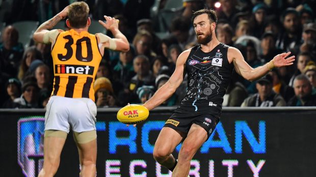 Night out: Port's Charlie Dixon kicks for one of his four goals.