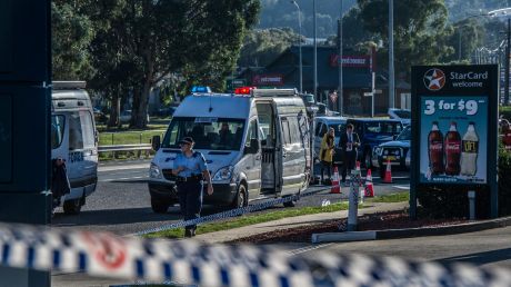 Police and emergency services at the scene of the Queanbeyan service station stabbing. 