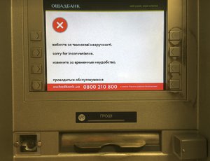 A screen of an idle virus affected cash machine in a state-run OshchadBank says "Sorry for inconvenience/Under repair" in Kiev, Ukraine, Wednesday, June 28, 2017