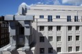 British artist Anthony Gormley's <i>Room</i>, which comprises a crouching figure on the facade of the Beaumont Hotel in ...