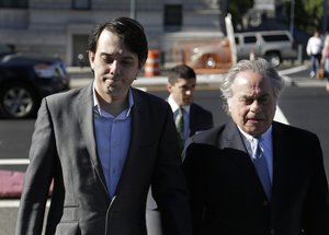 Martin Shkreli, left, arrives to federal court with his attorney Benjamin Brafman in New York, Monday, June 26, 2017. Even with his federal securities fraud trial set to begin Monday, Shkreli has blatantly defied his attorneys' advice to lay low. (AP Photo/Seth Wenig)