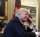 President Donald Trump speaks on the phone with Irish Prime Minister Leo Varadkar in the Oval Office of the White House.