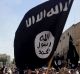 FILE - In this June 16, 2014 file photo, demonstrators chant pro-Islamic State group, slogans as they carry the group's ...