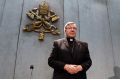 Cardinal George Pell arrives to make a statement at the Vatican on Thursday.
