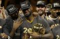 Emotional: LeBron James tears up as the Cavaliers receive the Larry O'Brien trophy after NBA Finals 2016. 