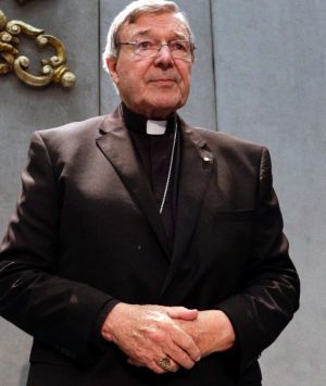 Cardinal George Pell arrives to make a statement at the Vatican on Thursday.