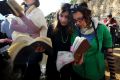 Members of Women of the Wall pray at the Western Wall wearing prayer shawls and phylacteries or prayer boxes, both of ...