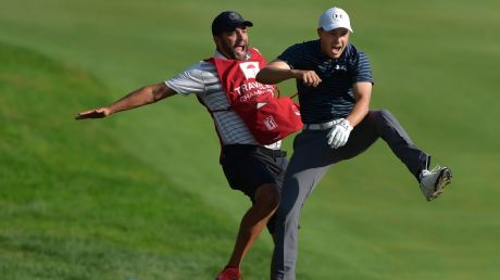 Master stroke: Jordan Spieth celebrates with caddie Michael Greller after Spieth holed a bunker shot on a playoff hole ...
