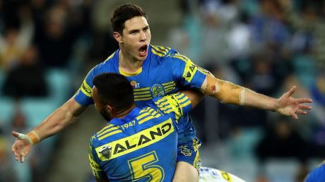 Hearts and minds: Mitch Moses celebrates after kicking the winning field goal in extra-time, winning over Parramatta ...