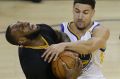 Cleveland Cavaliers forward LeBron James, left, is fouled by Golden State Warriors guard Klay Thompson during the first ...