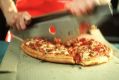 Domino's may have to share more profit with franchisees, which would hurt its returns.