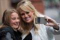 Hollywood actress Rebel Wilson poses with a young fan outside Melbourne's Supreme Court earlier this month. 