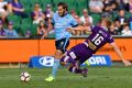 PERTH, AUSTRALIA - MARCH 26: Joseph Mills of the Glory contests the ball with Joshua Brillante of Sydney FC during the ...