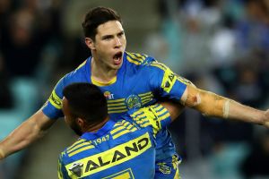 Hearts and minds: Mitch Moses celebrates after kicking the winning field goal in extra-time, winning over Parramatta ...