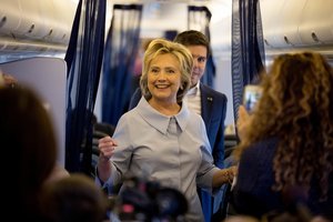 Democratic presidential candidate Hillary Clinton speaks to members of the media on her first flight on a new campaign plane before taking off at the Westchester County Airport in White Plains, N.Y., Monday, Sept. 5, 2016, to travel to Cleveland Hopkins International Airport for Labor Day events.