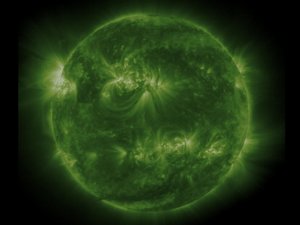 Caption: This movie begins with a full-disk view of the Sun from the Solar and Heliospheric Observatory (SOHO) spacecraft. The image is in false color, and coronal loops extend in all directions from the Sun's surface, making it look like a fuzzy ball. The second part of the movie uses images from the TRACE spacecraft to zoom in close to a group of coronal loops near the center of the solar disk. This sequence is also in false color, and electrified gas streams along the loops (especially the ones directed towards the bottom left of the image), giving them the appearance of a fountain. This is evidence for the idea that coronal loops are currents of electrified gas being propelled against solar gravity