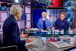 U.S. Secretary of State John Kerry chats with Joe Scarborough and Mika Brzezinski, co-hosts of the MSNBC program "Morning Joe," before appearing on the program on April 5, 2016, in the NBC Studios in New York.