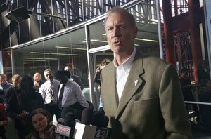 Illinois Gov. Bruce Rauner talks with reporters at the Thompson Center in Chicago, Friday, March 3, 2017, after his meeting with Grammy-winning artist Chance the Rapper. (AP Photo/Sophia Tareen)