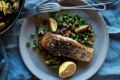 Crispy skin barra with mint peas and brussels with bacon peas mint and brussels at Three Blue Ducks in Sydney.