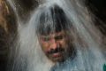 A family cools off in a stream during a heat wave last month in Islamabad, Pakistan.