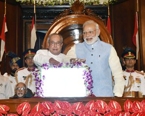 The President, Shri Pranab Mukherjee and the Prime Minister, Shri Narendra Modi pressing the buzzer to launch the Goods & Service Tax (GST), in Central Hall of Parliament, in New Delhi on June 30, 2017.