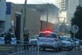 A man has been hospitalised after a fire at a mechanic in Southbank.