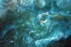 SYDNEY, NEW SOUTH WALES - JUNE 16: An aerial view of surfers at Mackenzies Beach on June 16, 2017 in Sydney, Australia. ...