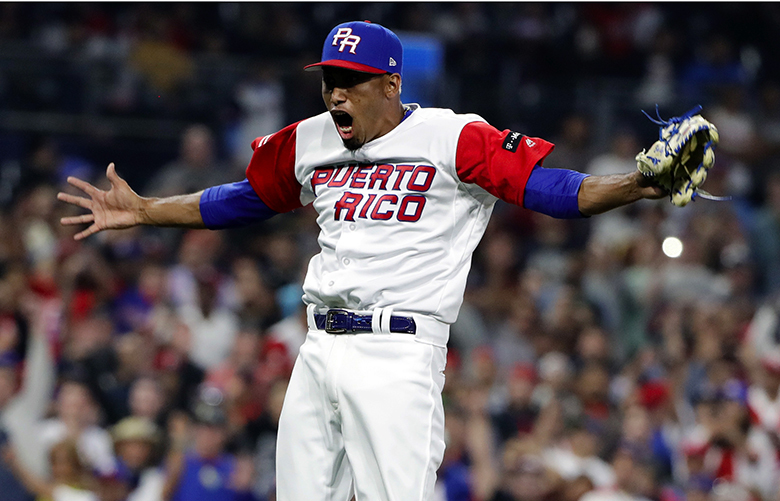 Puerto Rico pitcher Edwin Diaz reacts after getting the last out to defeat the Dominican Republic in a second-round World Baseball Classic game Tuesday, March 14, 2017, in San Diego. Puerto Rico won, 3-1. (AP Photo/Gregory Bull)