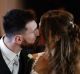 Newlyweds Lionel Messi and Antonella Roccuzzo kiss