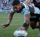 Sharks frenzy: Ricky Leutele crosses over for Cronulla.